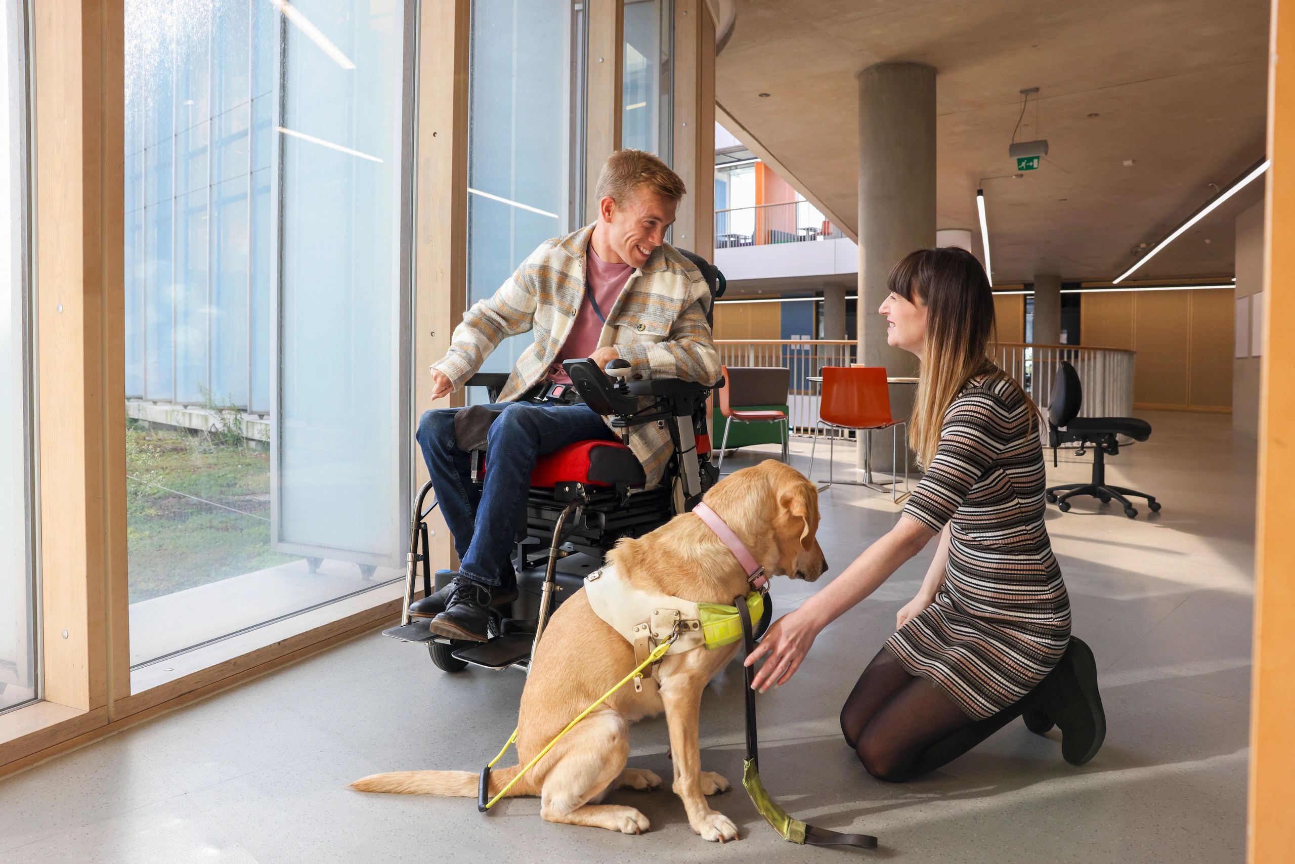 Man with cerebral palsy and blind woman with guide
